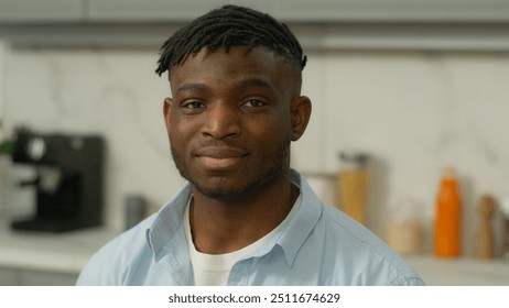 Portrait happy smiling African American friendly renter homeowner man at home kitchen modern morning breakfast food delivery smile biracial male ethnic guy rent flat house apartment loan mortgage - Powered by Shutterstock