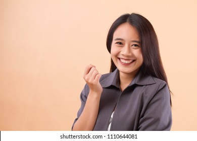 Portrait Of Happy Smiling Asian Business Woman Hand Holding Something; Happy Smiling Successful Business Woman In Formal Suit Studio Isolated Hand Holding Blank Space; Asian Young Adult Woman Model