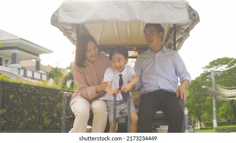 Portrait Of Happy Smiling Asian Family Living Together On Golf Cart, In Family Relationship On Vacation. Love Of Father, Mother, And Son. People Lifestyle.