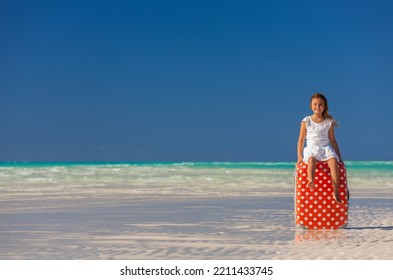 Portrait Of Happy Smiling Caucasian Girl With Red Polka Dot Travel Baggage On Her Tropical Beach Vacation Resort Bahamas