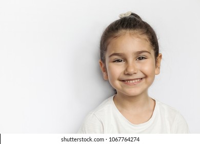 Portrait Of Happy Smiling Child Girl Isolated On White Background