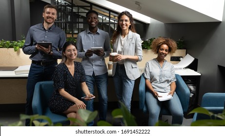 Portrait Happy Smiling Diverse Employees Team In Modern Office, Successful Workers Looking At Camera, Posing For Corporate Photo, Professionals Group Motivated For Business Success