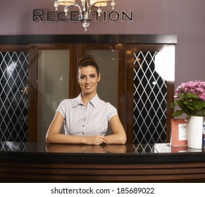 Portrait Of Happy Smiling Female Receptionist At Hotel.