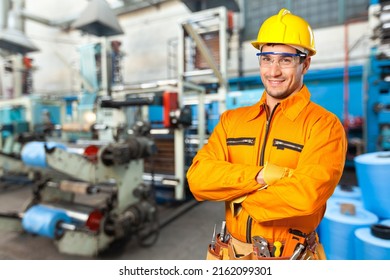 Portrait Of Happy Smiling Industrial Worer With Safety Helmet, Concept Of Safety Measures, Skilled Labour And Workforce.