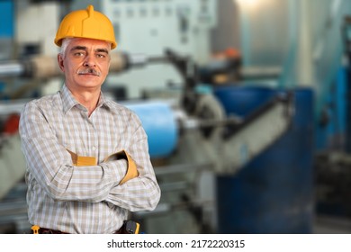 Portrait Of Happy Smiling Industrial Worer With Safety Helmet, Concept Of Safety Measures, Skilled Labour And Workforce.