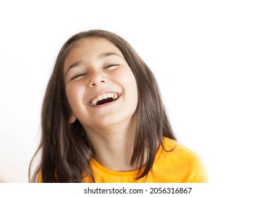 Portrait Of Happy Smiling Kid Girl In Yellow T-shirt Isolated On White Background