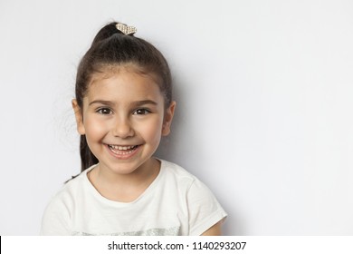 Portrait Of A Happy Smiling Latin Child Girl On White Background