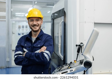 Portrait of happy smiling male engineer workers standing crossed arms in manufacturing factory workplace. professional technician production at factory. - Powered by Shutterstock