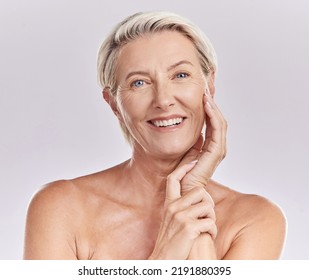 Portrait Of Happy Smiling Mature Caucasian Woman Looking Positive And Cheerful Against Studio Background. Smooth Face And Skin Of An Older Female Or Antiaging Beauty Model Doing Her Skincare Routine