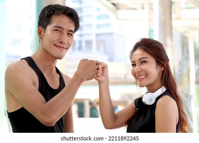 Portrait Of Happy Smiling Partner Buddy Sport Runner Man And Woman Lover Joining Fists, Exercise Run Outdoor, Partner Buddy Runner Jogger Athlete Training And Doing Workout In Downtown City.