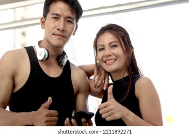 Portrait Of Happy Smiling Partner Buddy Runner Man And Woman Lover Giving Thumbs Up, Exercise Run Outdoor, Partner Buddy Runner Jogger Athlete Training And Doing Workout In Downtown City.