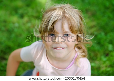 Similar – Small child with long blond hair enjoying of a sunny day