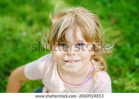 Similar – Small child with long blond hair enjoying of a sunny day