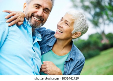portrait of happy smiling senior couple outdoors - Powered by Shutterstock