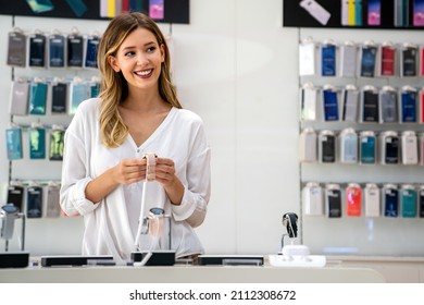 Portrait Of Happy Smiling Woman Shopping A New Smart Watch In Tech Store. Technology People Concept