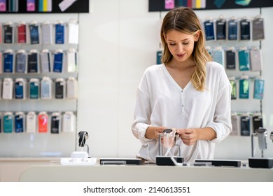 Portrait Of Happy Smiling Woman Shopping A New Smart Watch In Tech Store. Technology People Concept