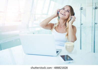 Portrait Happy Smiling Young Bisness Woman With Headphones Listening Music Working On Laptop At Office Desk