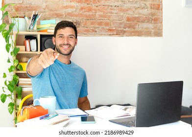 Portrait Of A Happy Student Pointing A Pen At The Camera With Copy Space. Successful Business Person Looking For The Ideal Person. Smart, Self-confident And Friendly Entrepreneur