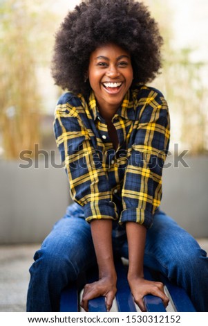 Similar – blYoung black woman, afro hairstyle, smiling outdoors