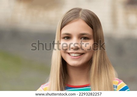 portrait of happy teen girl. portrait of teen girl with blonde hair. portrait of teen girl outdoor