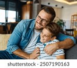 Portrait of a happy teenage boy son and his father at home. Sharing secrets and having fun, support and parenthood concept