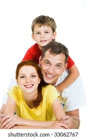 Portrait of happy three people in a huddle - Shutterstock ID 33062767