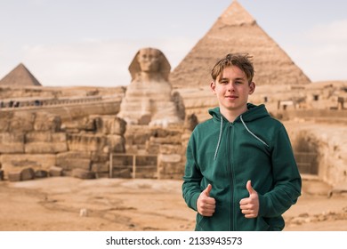Portrait  of happy tourist  man wallking on pyramid of Egyptian 