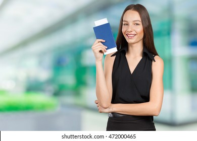 Portrait Of Happy Tourist Woman Holding Passport 