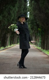 Portrait Of A Happy Woman At Cemetery