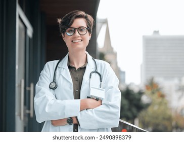 Portrait, happy woman and doctor with crossed arms for healthcare services, career or medicine in hospital. Proud, medical professional and confident physician with smile in clinic or outdoor balcony - Powered by Shutterstock