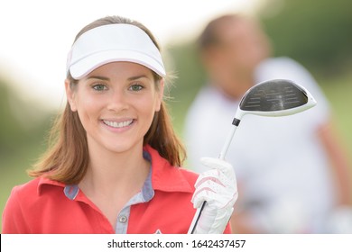 Portrait Of Happy Woman Golfer Posing