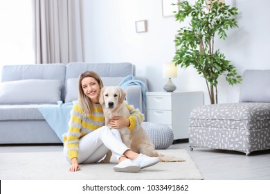 Portrait Of Happy Woman With Her Dog At Home