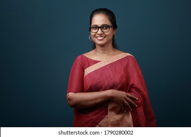 Portrait of a happy woman of Indian origin wearing traditional dress sari