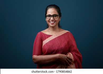 Portrait Of A Happy Woman Of Indian Origin Wearing Traditional Dress Sari