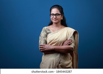 Portrait of a happy woman of Indian origin wearing traditional dress Sari