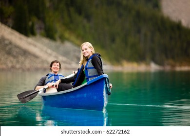 A Portrait Of A Happy Woman On A Canoeing Trip With A Man