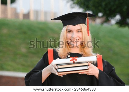 Portrait of a happy woman on her graduation day at university. Education and people