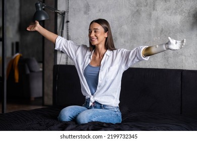 Portrait Happy Woman With Prosthetic Arm, Girl With Disability Relaxing Raising Arms Artificial Prosthetic Limb