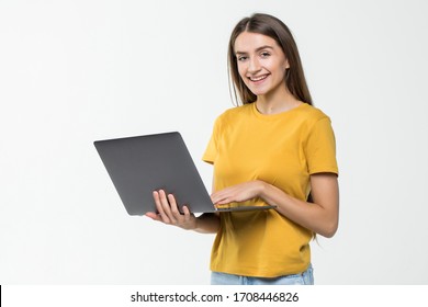 Portrait Of A Happy Woman Working On Laptop Computer Over White Background