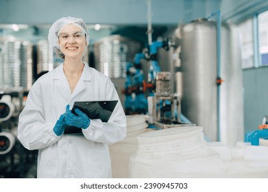 portrait happy women staff worker in drinking water plant work control water quality purification test process. - Powered by Shutterstock