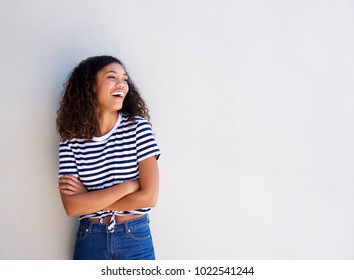 Portrait of happy young african american woman standing against white background