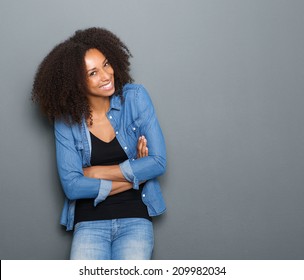 Portrait Of A Happy Young African American Woman Posing With Arms Crossed