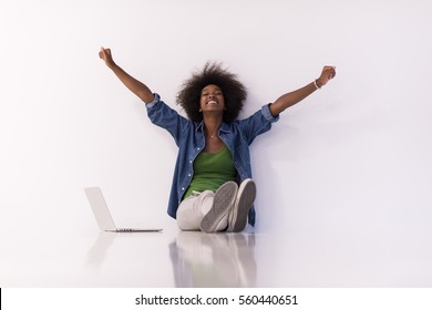 Portrait Of Happy Young African American Woman Sitting On Floor With Laptop