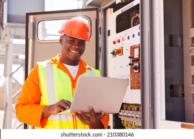 Portrait Of Happy Young African Electrical Engineer With Laptop