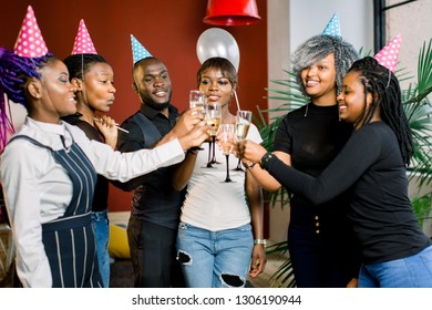 Portrait Of Happy Young African Friends Touching The Glasses With Each Other And Celebrating Birthday