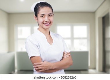 Portrait Of A Happy Young Asian Nurse.