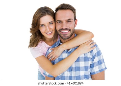 Portrait Of Happy Young Couple Embracing On White Background