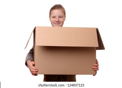 Portrait Of A Happy Young Girl Carrying A Large Box