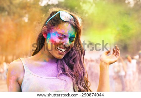 Portrait of happy young girl on holi color festival