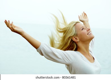 Portrait of happy young girl with stretched arms enjoying life - Powered by Shutterstock